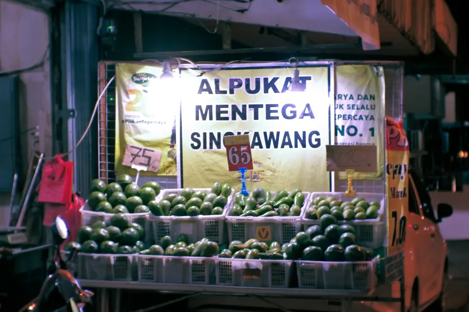 a fruit stand with a lot of fruit on display